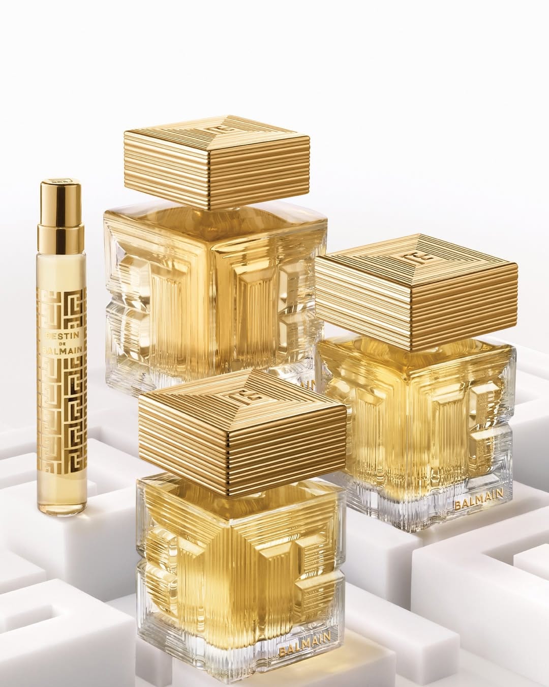 Balmain Beauty fragrance product photo: champagne gold, clear glass and warm gold, glass and metal, studio light