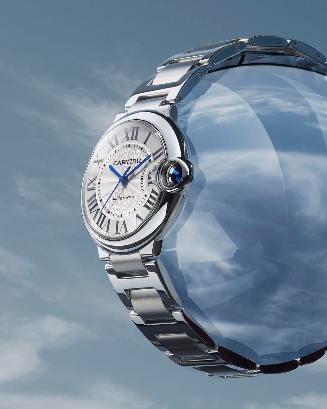 Cartier Ballon Bleu product photo: steel silver, pale blue and rose gold, metal, studio light