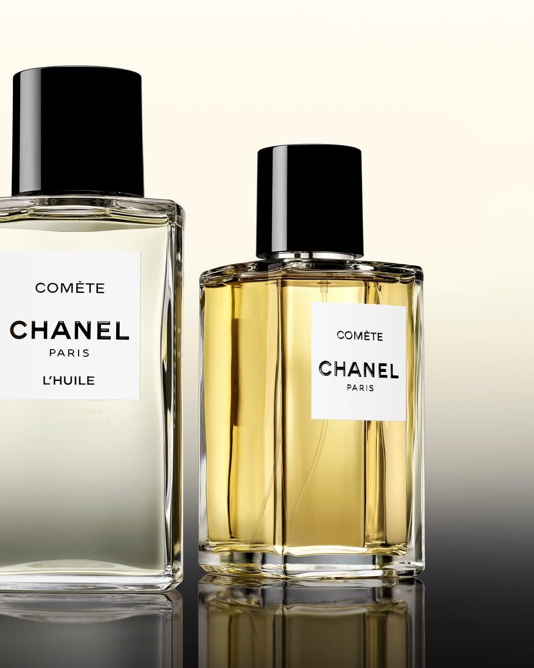 CHANEL Les Exclusifs product photo: pale gold, clear glass and black cap, glass, soft light, image 1 of 3