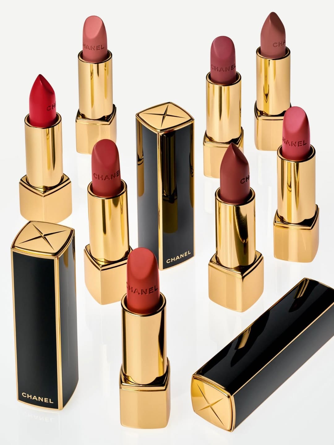 Chanel Rouge Allure Velvet product photo: gold, black lacquer and lipstick red, metal, bright light