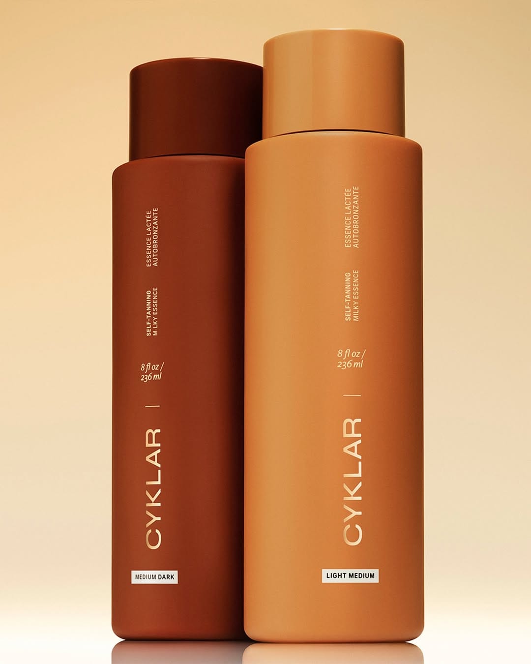 CYKLAR bodycare product photo: bronze brown, caramel tan and cream, plastic and skin, studio light