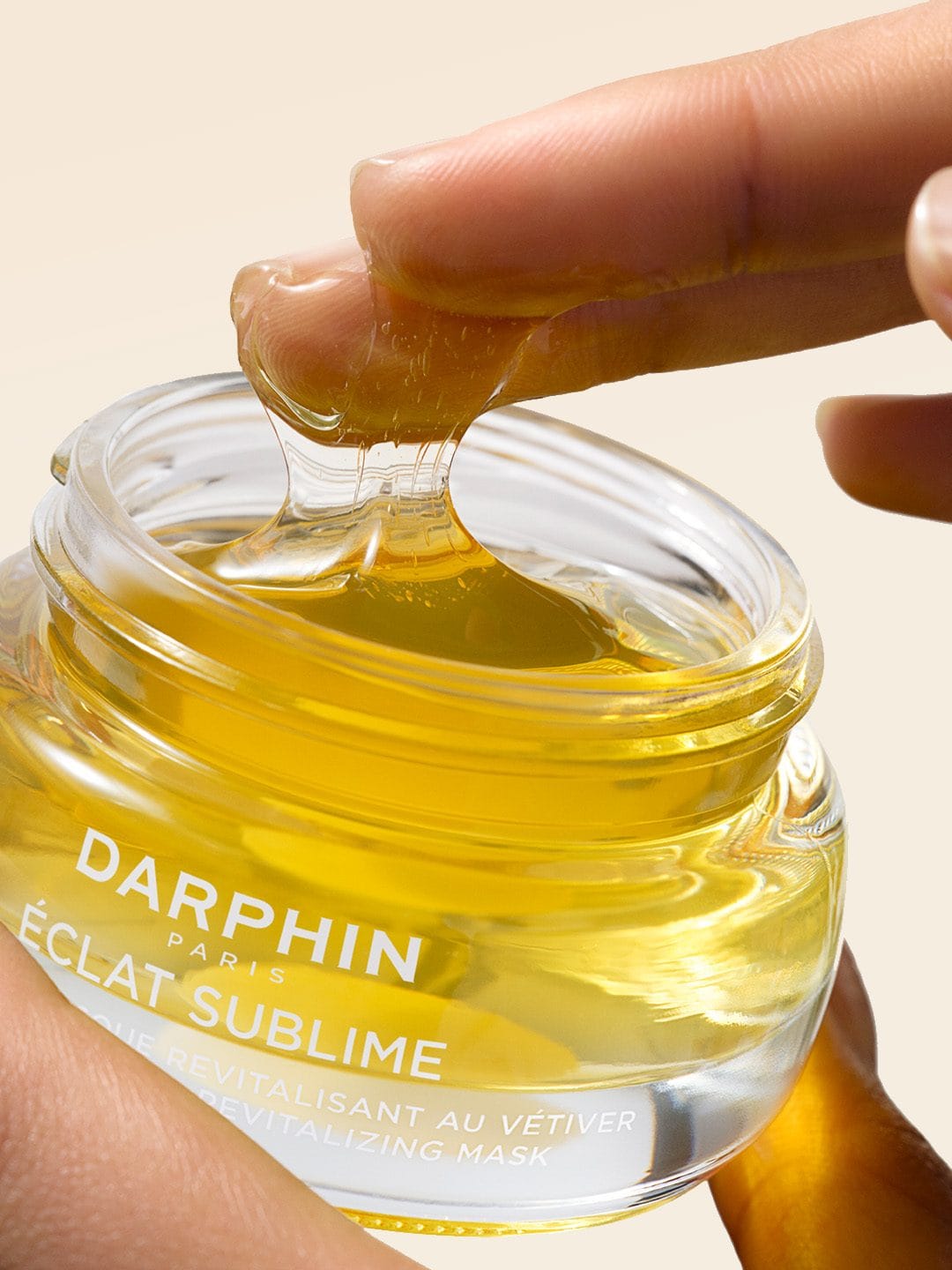 Darphin Éclat Sublime product photo: golden yellow, amber gold and clear glass, glass, soft light