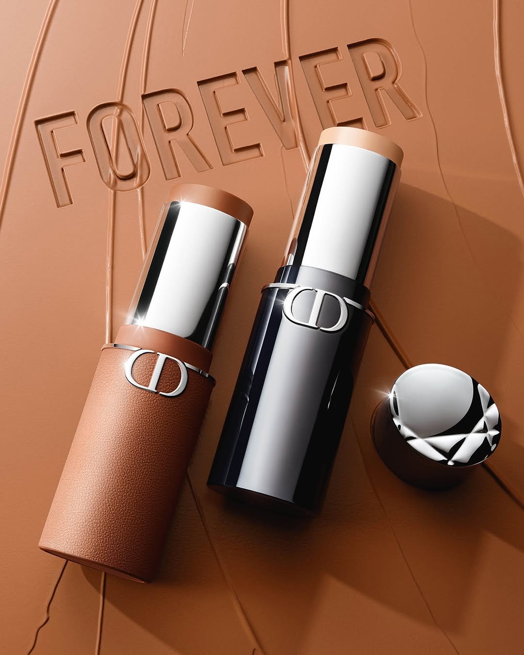 Dior Forever product photo: bronze, chrome silver and black, leather, soft light, image 1 of 5