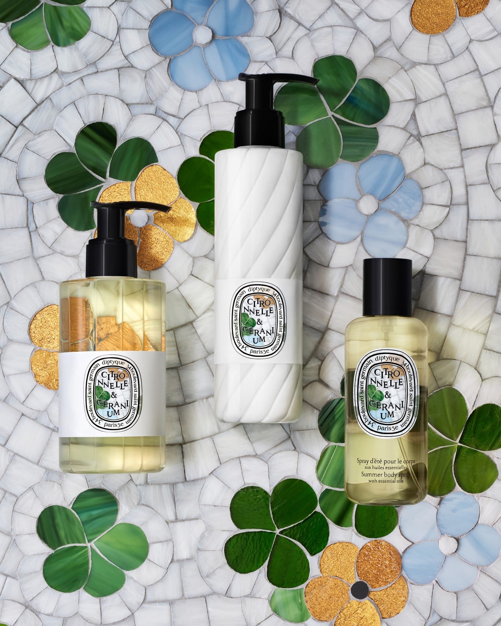 Diptyque candles product photo: milky white, black pump, golden liquid and clear glass, glass and stone, soft light