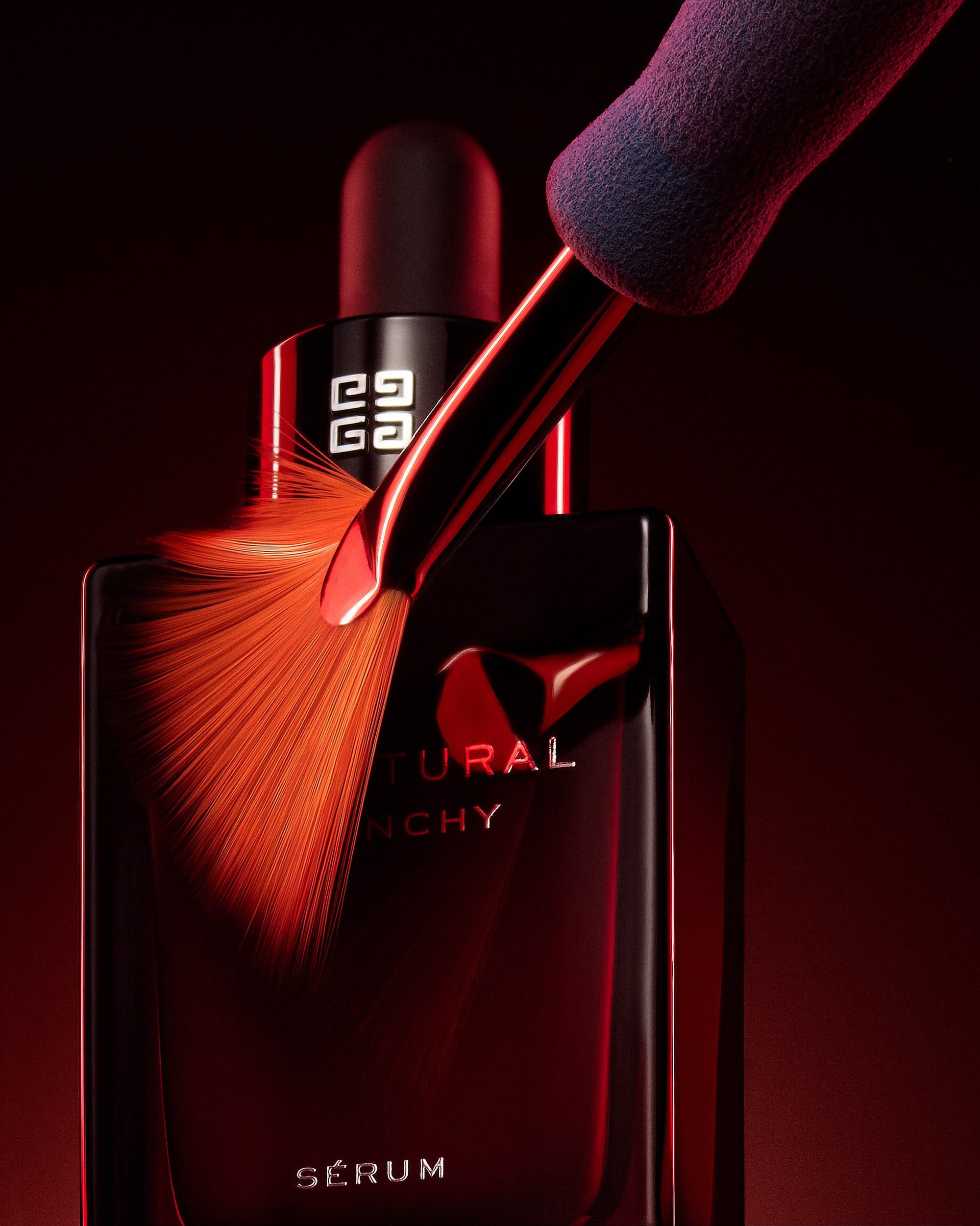 Givenchy Sculptural Serum product photo: deep red and black, glass, dramatic light