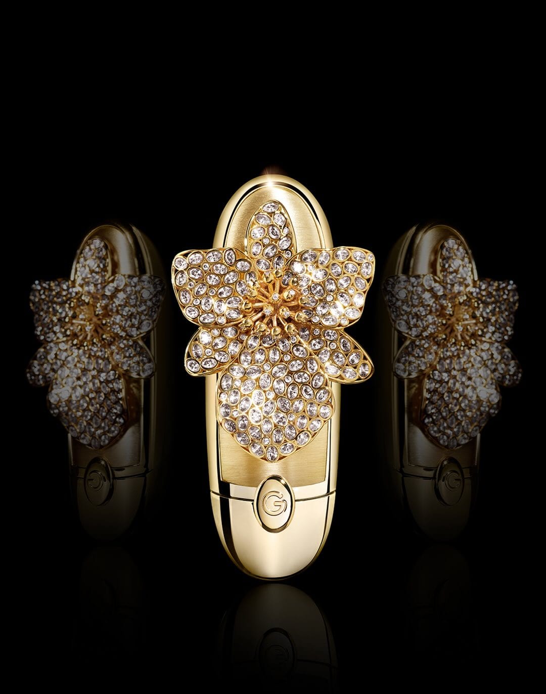 Guerlain fragrance photography product photo: polished gold, amber and magenta, glass, dramatic light, image 2 of 2