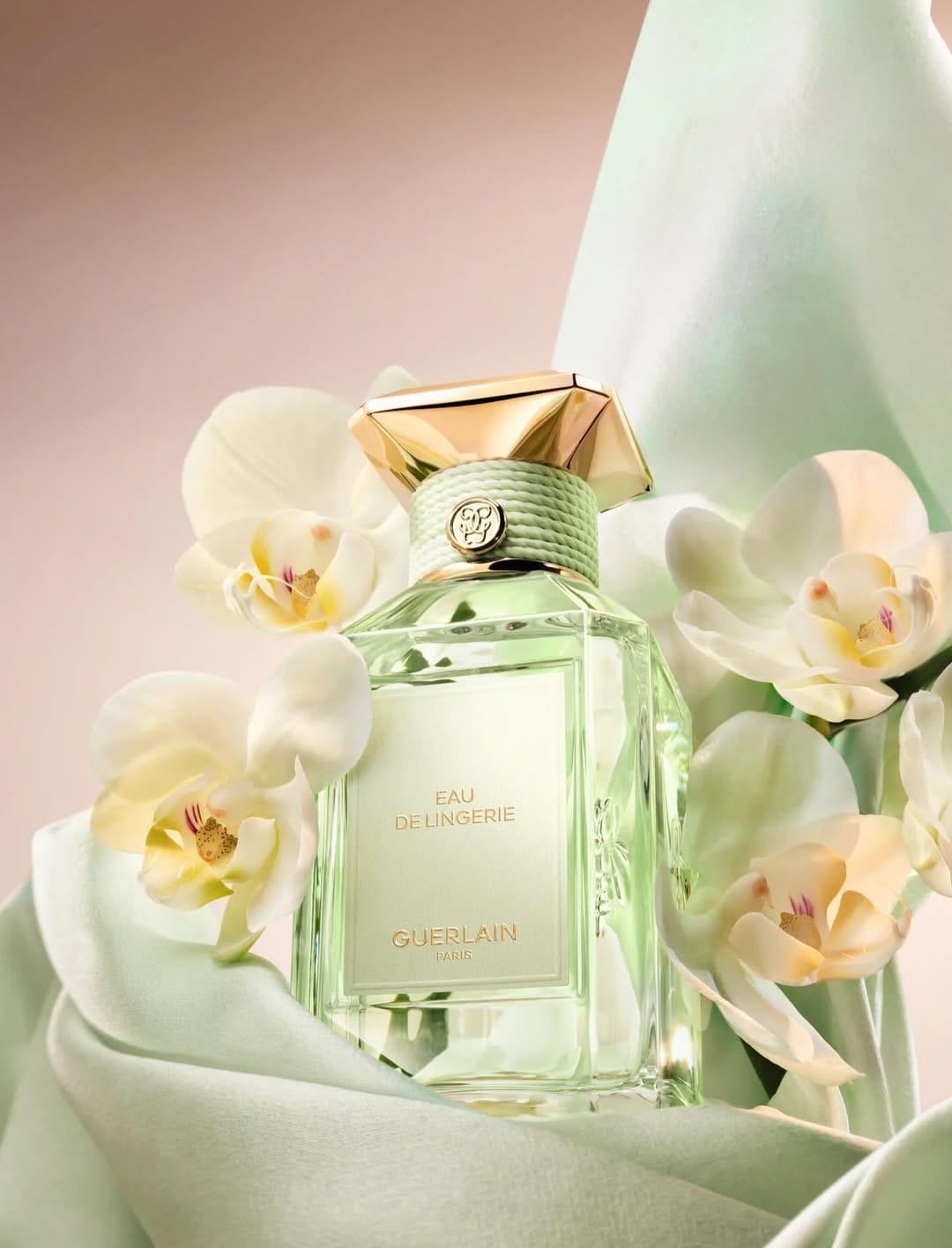Guerlain fragrance photography product photo: champagne gold, blush pink, cream and pale green, glass, soft light, image 3 of 6