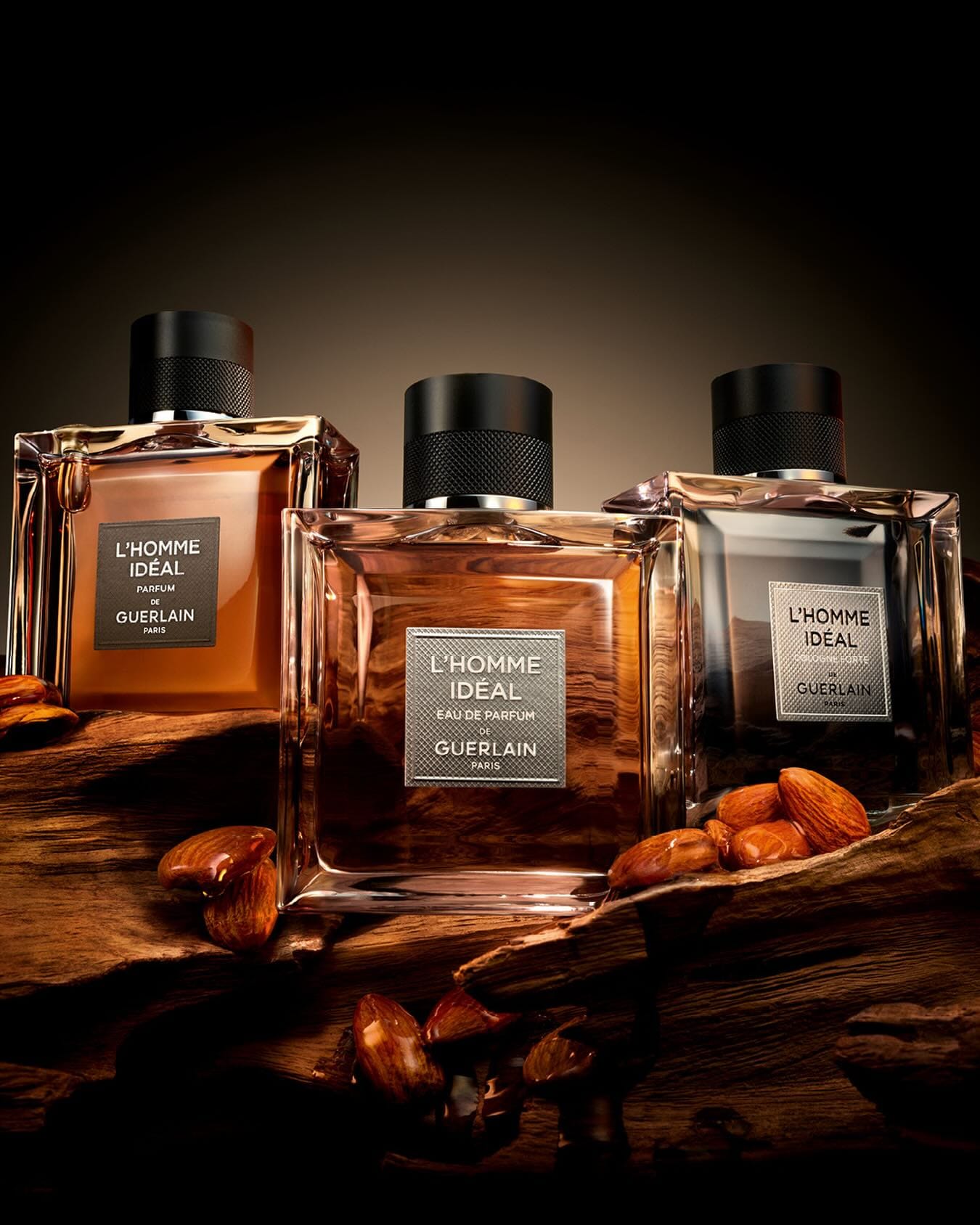 Guerlain L'Homme Idéal product photo: amber, black cap and smoked grey, glass, dramatic light