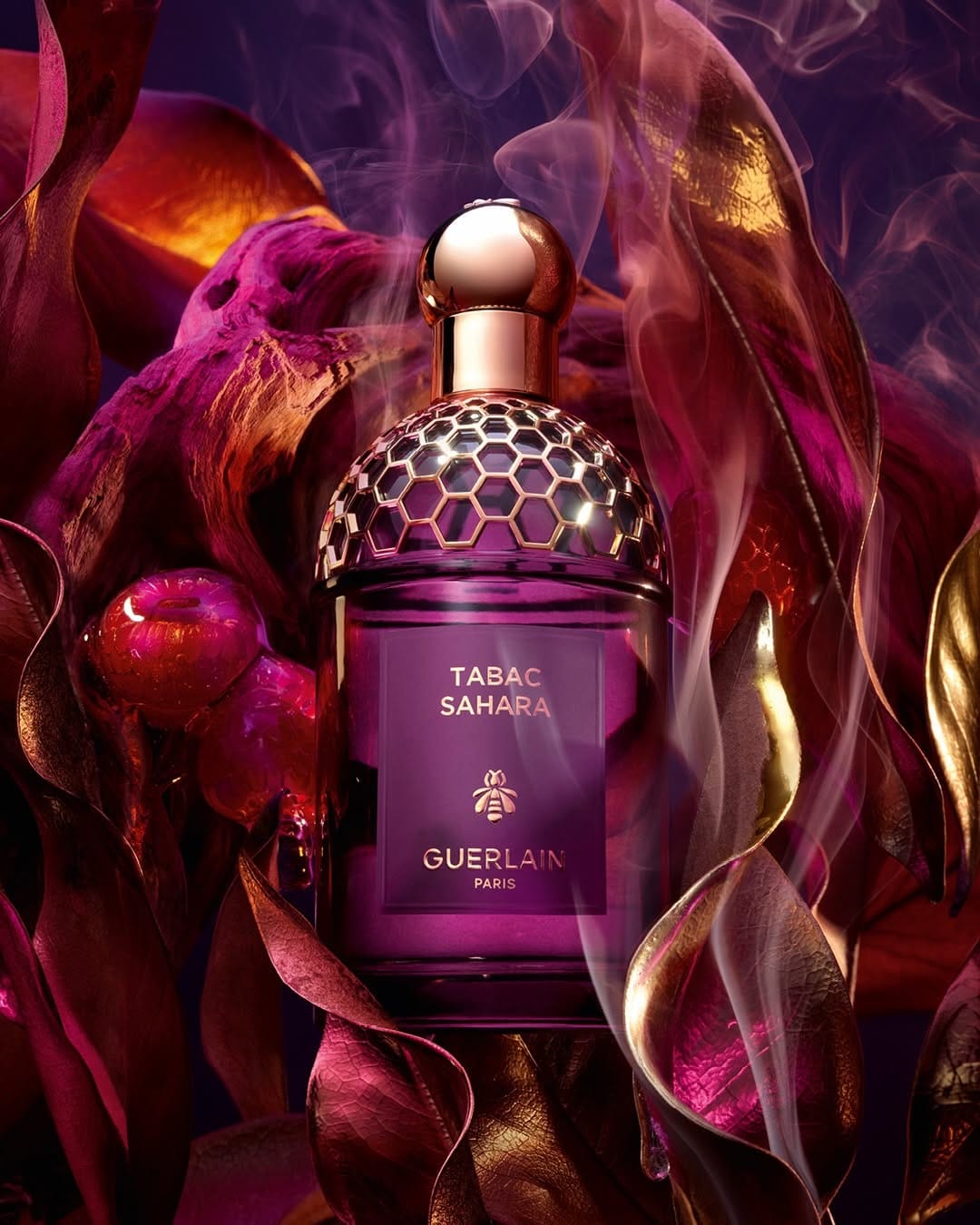 Guerlain Rouge G product photo: plum, magenta and rose gold, glass, dramatic light