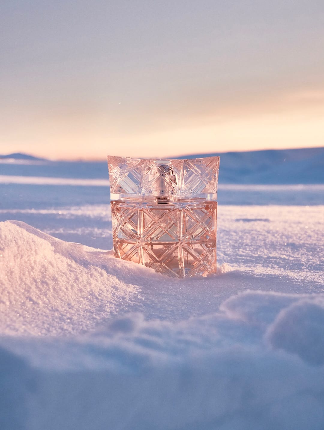 Issey Miyake Parfums product photo: clear glass and blush pink, glass, natural light
