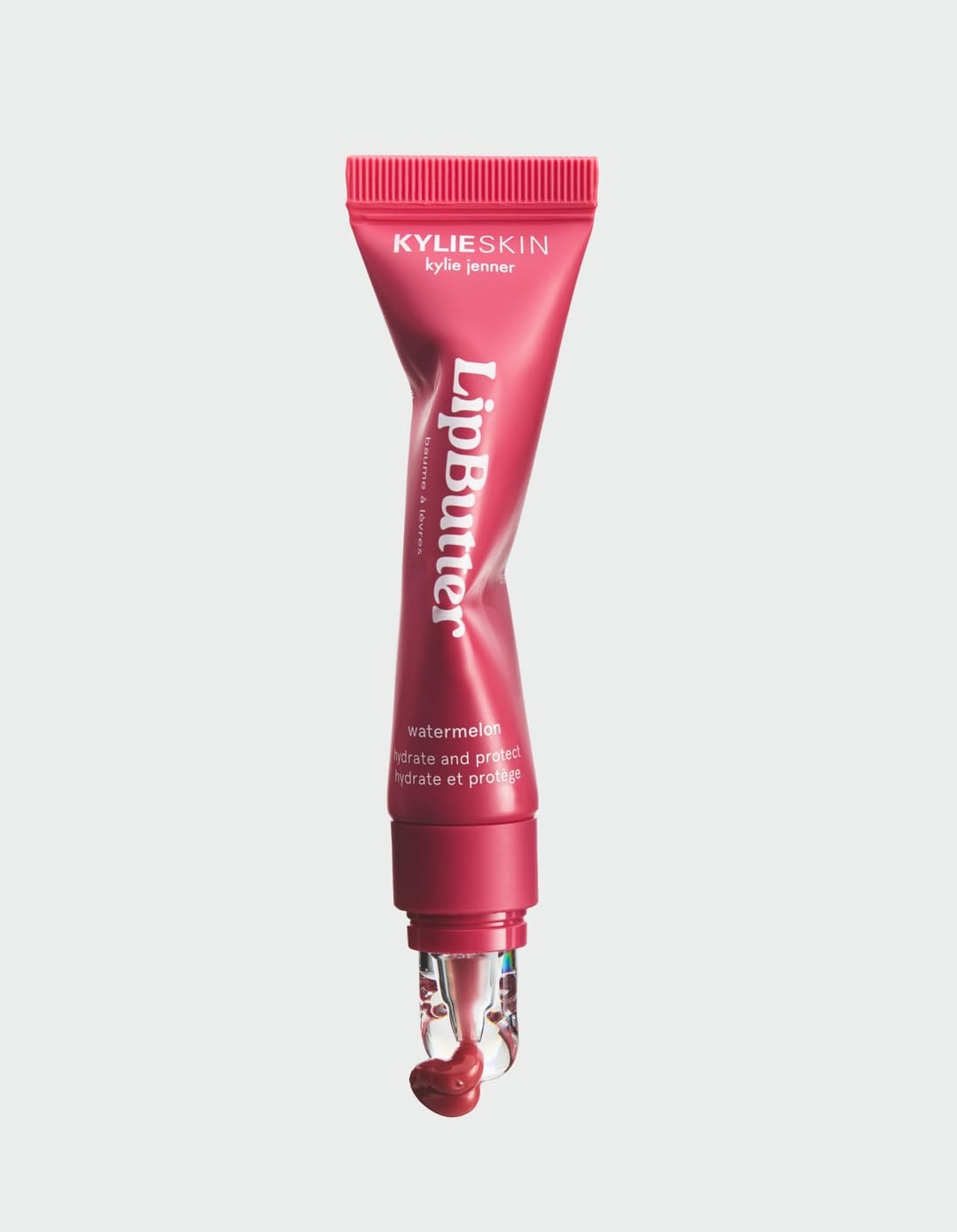Kylie Cosmetics lip gloss product photo: raspberry pink and rose, plastic, soft light