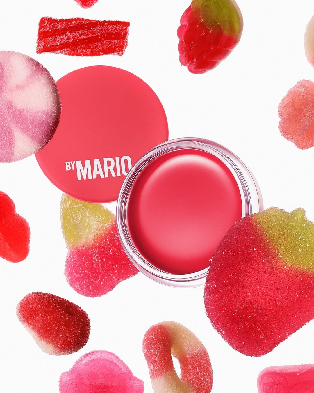 Makeup by Mario's jelly balm product photo: coral pink and cherry red, glass, soft light, image 8 of 8