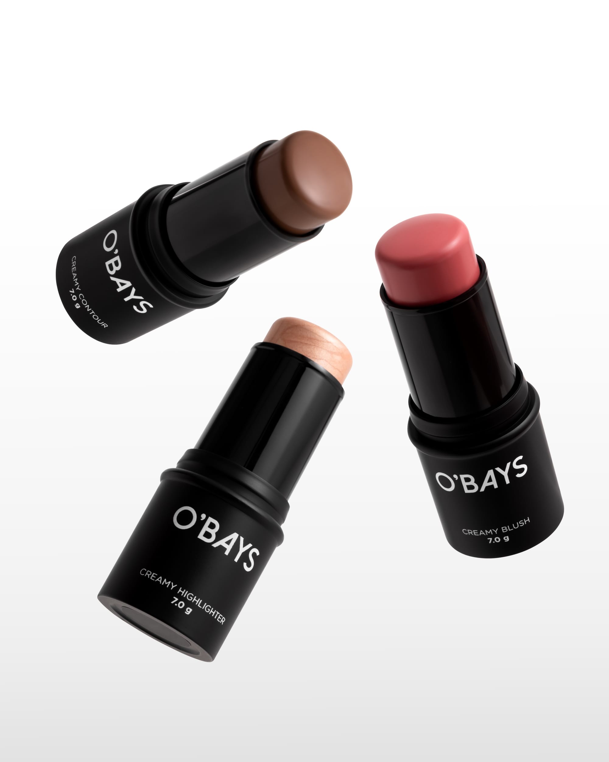 O'BAYS cosmetics product photo: matte black, rose pink, mocha brown and peach nude, plastic, studio light