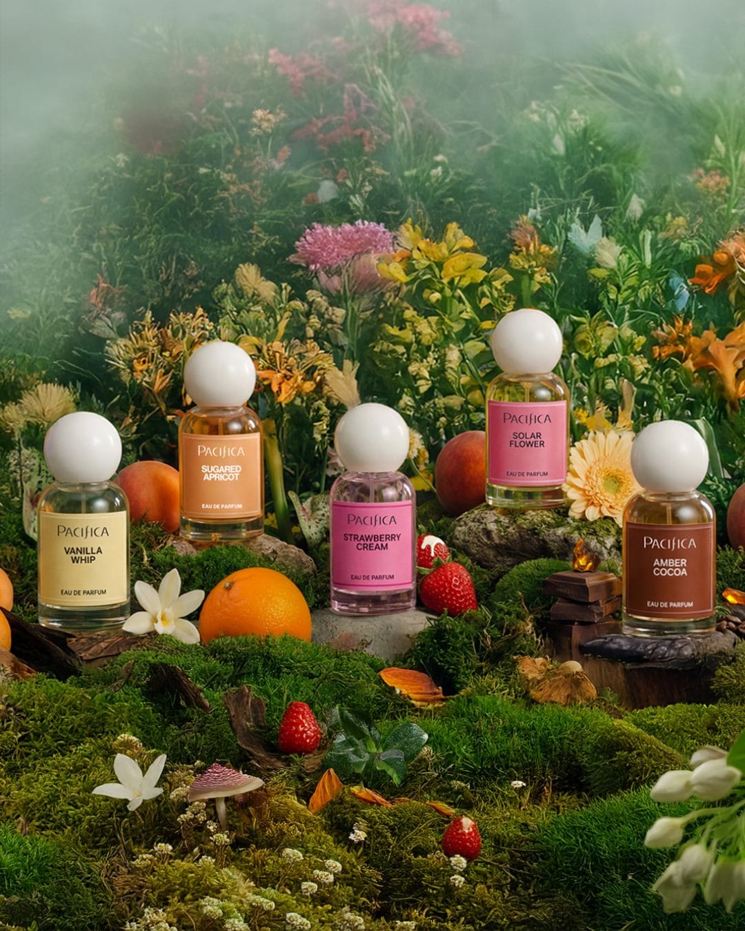 Pacifica's fragrance line product photo: white cap, amber, pink and pale yellow, glass, natural light