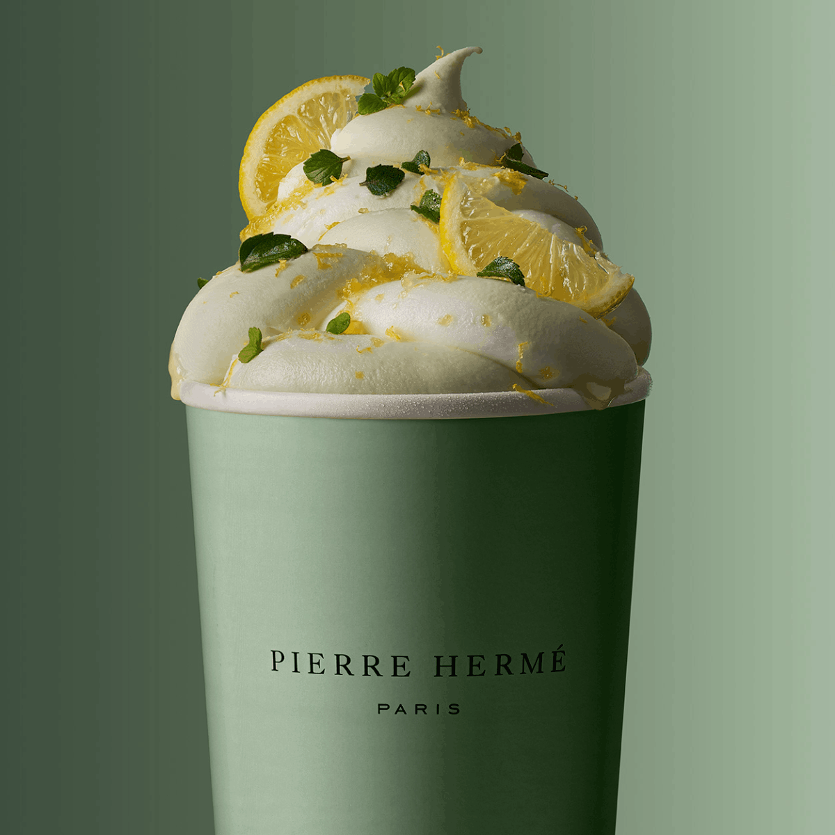 Pierre Hermé macarons product photo: sage green, sky blue, mustard and raspberry pink, paper, soft light