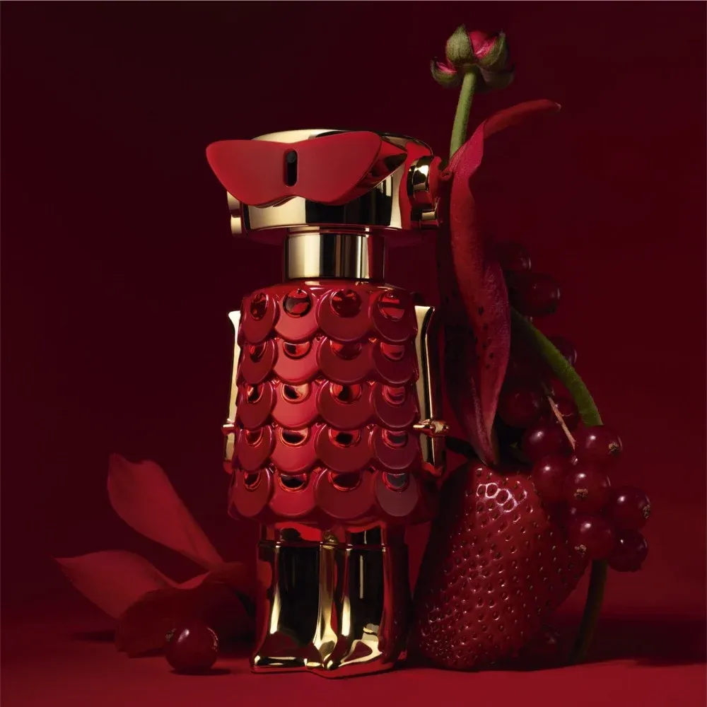 Rabanne Fame In Love product photo: crimson, gold and deep burgundy, metal and plastic, dramatic light