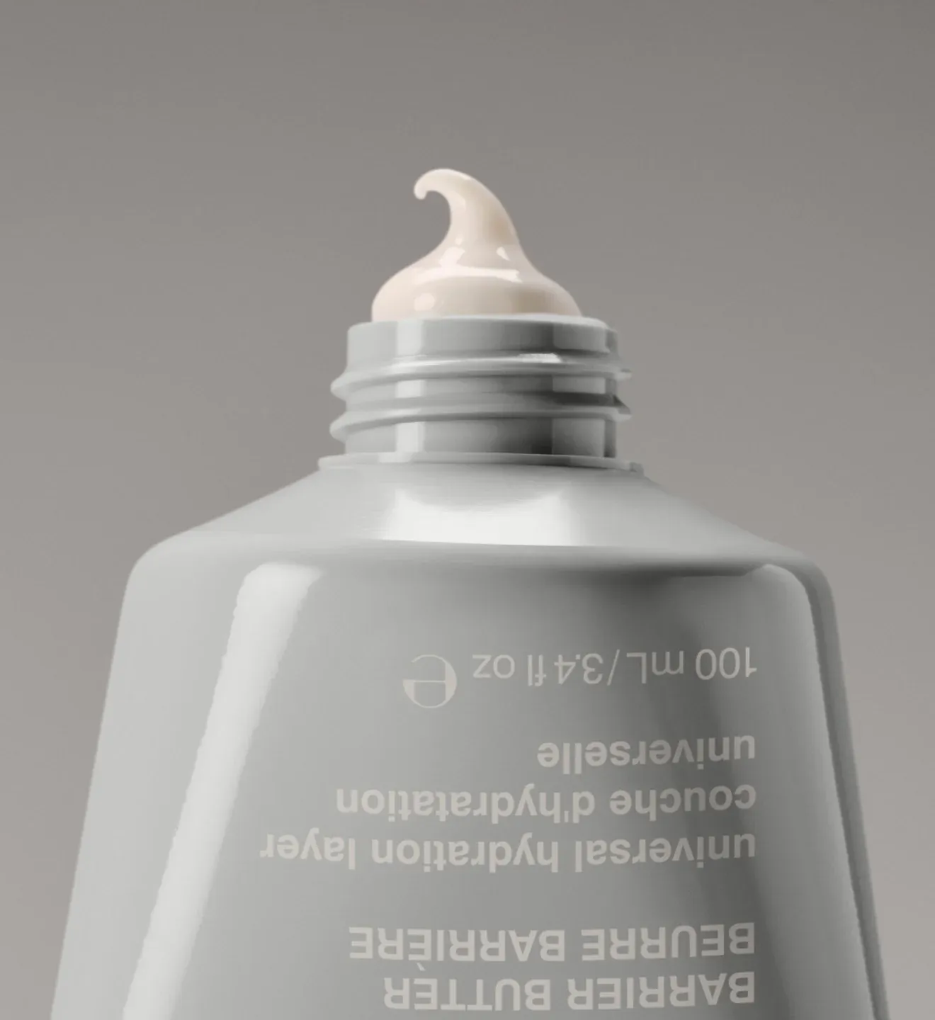 Rhode Skin product photo: warm grey and cream white, plastic, soft light, image 1 of 3