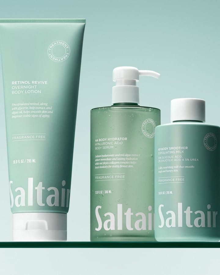Saltair body care product photo: sage green and white cap, plastic, soft light